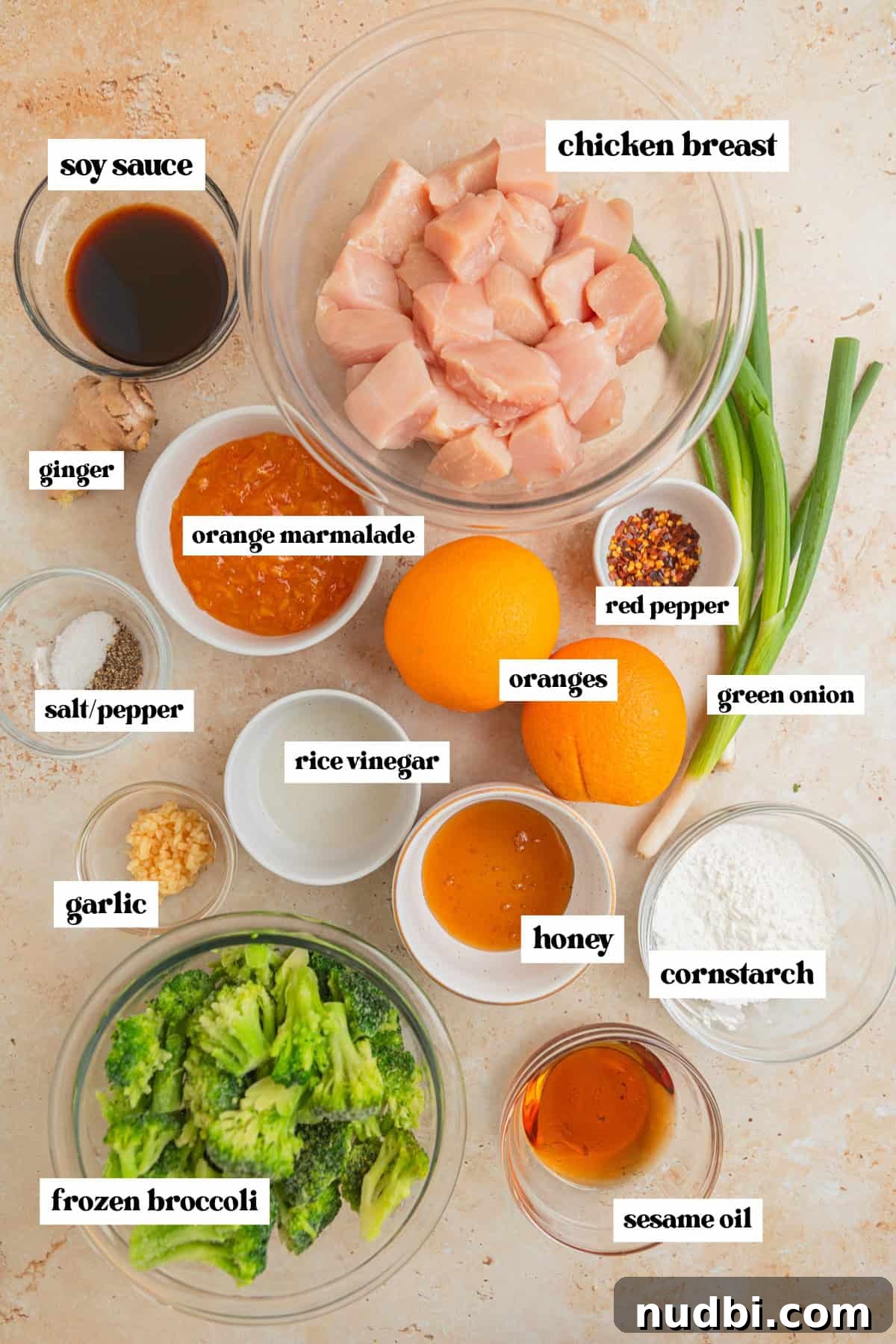 Slow-Cooker Orange Chicken Recipe for Tender, Saucy Chicken 3 Cubed chicken breast, frozen broccoli, oranges, green onion and other ingredients needed to make orange chicken in crockpot.