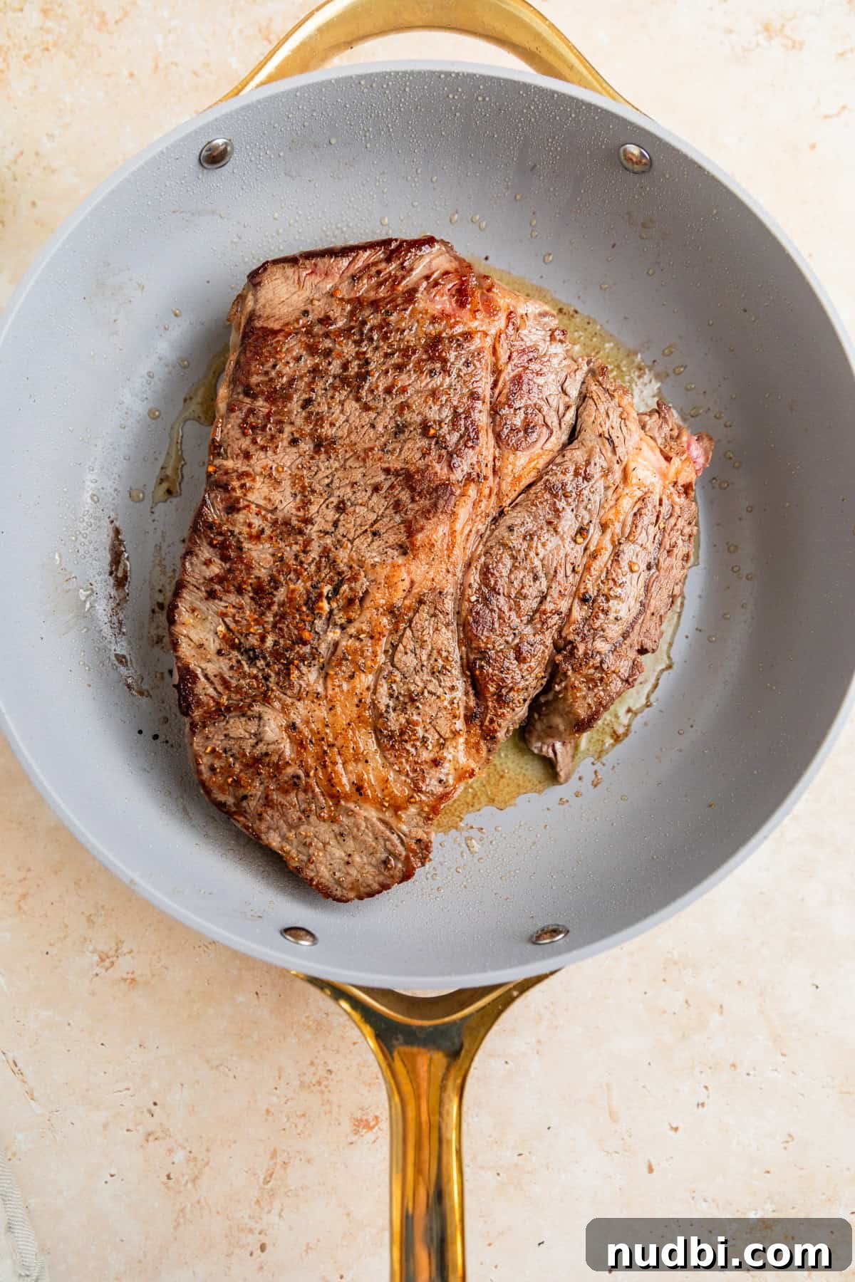 Slow-Cooker Shredded Beef Tacos Recipe for Tender, Flavorful Meat 5 Seared chuck roast in pan.