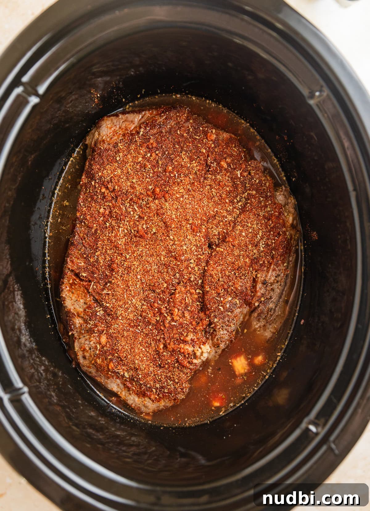 Slow-Cooker Shredded Beef Tacos Recipe for Tender, Flavorful Meat 6 Seasoned beef chuck roast in crock pot before cooking.
