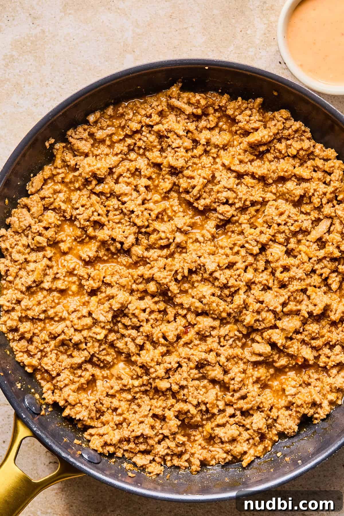 Savory Ground Turkey Rice Bowls with Veggies and Soy-Ginger Sauce 7 Skillet with ground turkey browned in sauce.
