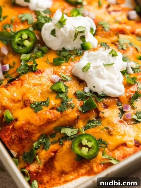 Savory Ground Turkey Rice Bowls with Veggies and Soy-Ginger Sauce 10 Ground turkey enchiladas in baking pan topped with sour cream, cilantro, onion and jalapeño.