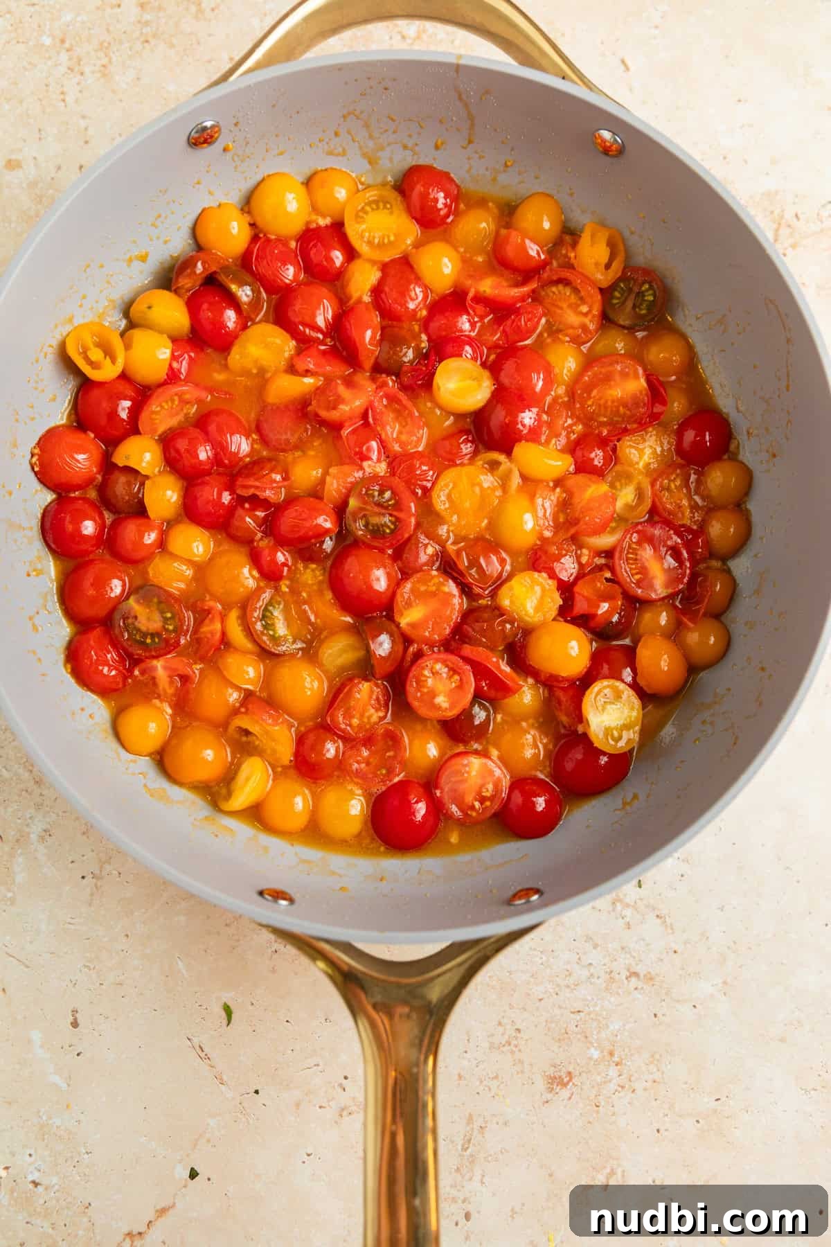 Quick Cherry Tomato Pasta Recipe for Fresh Weeknight Dinners 6 Simmering tomatoes in pan.