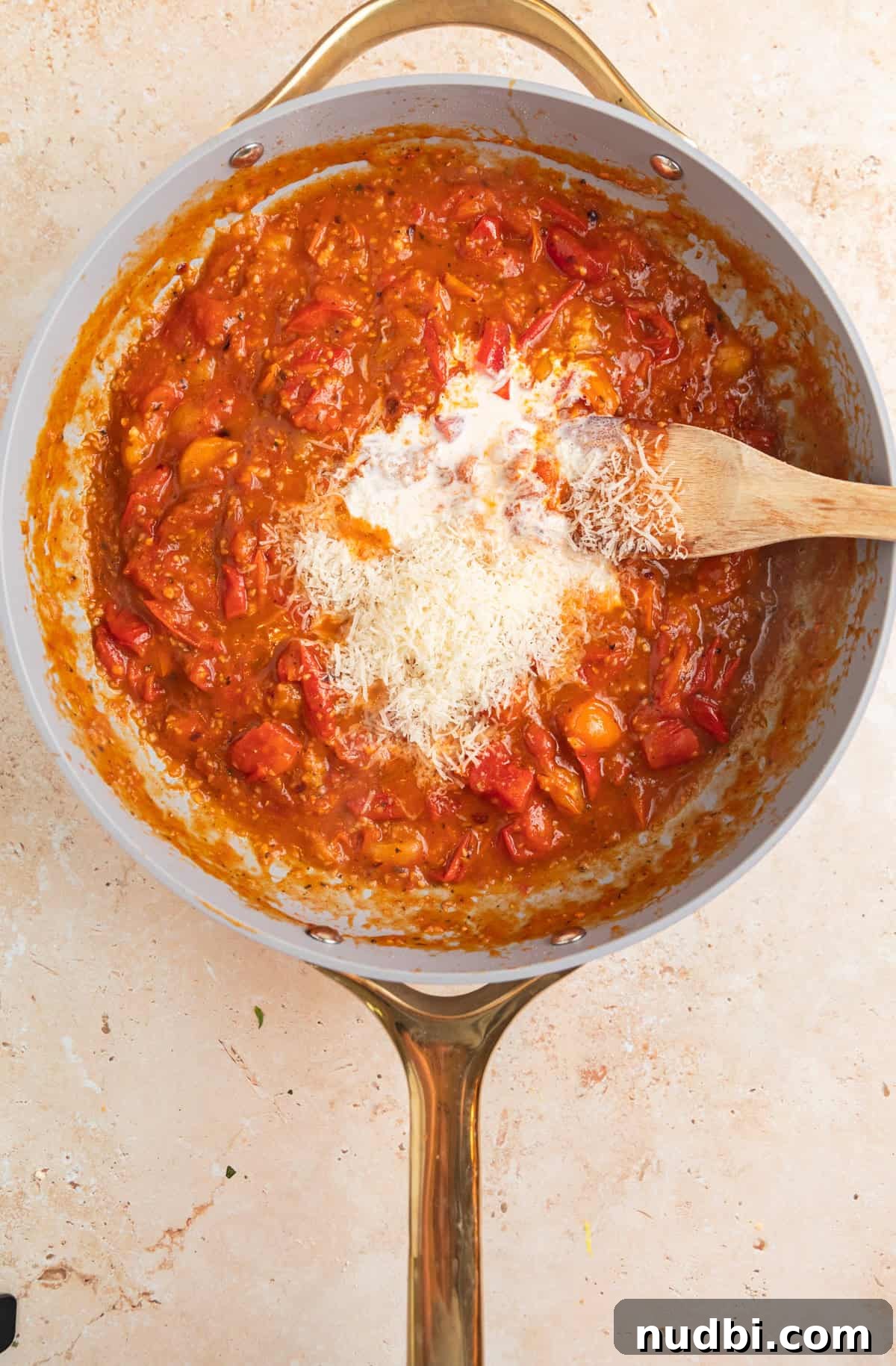 Quick Cherry Tomato Pasta Recipe for Fresh Weeknight Dinners 8 Parmesan and cream added to cherry tomato sauce in skillet.