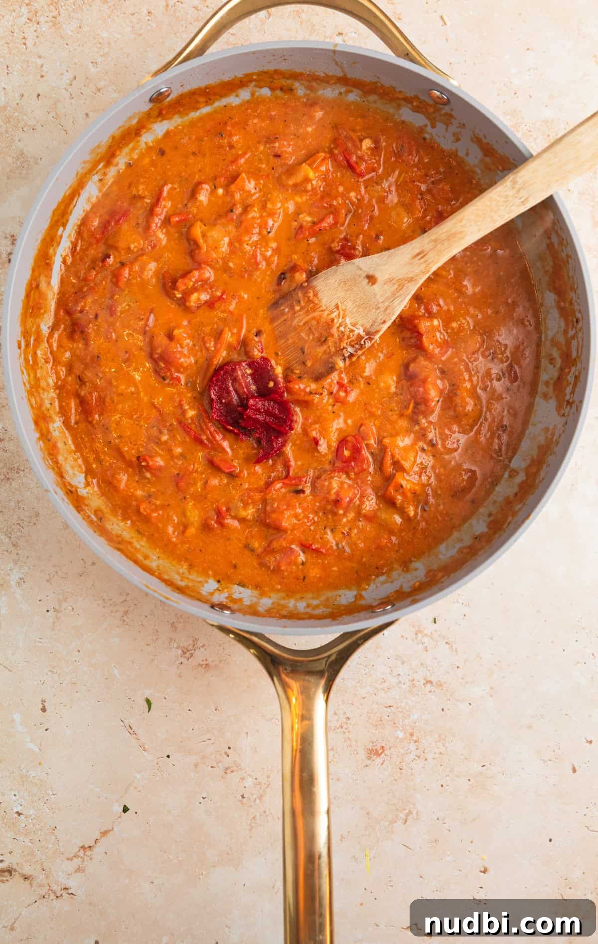 Quick Cherry Tomato Pasta Recipe for Fresh Weeknight Dinners 9 Pan with cherry tomato sauce with tomato paste added in.