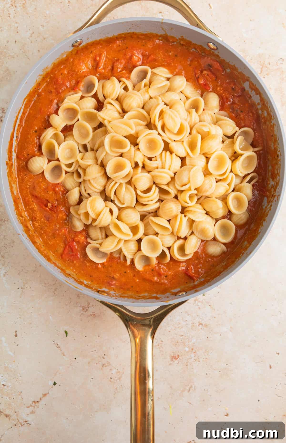 Quick Cherry Tomato Pasta Recipe for Fresh Weeknight Dinners 10 Cooked pasta added to pan with fresh cherry tomato sauce.