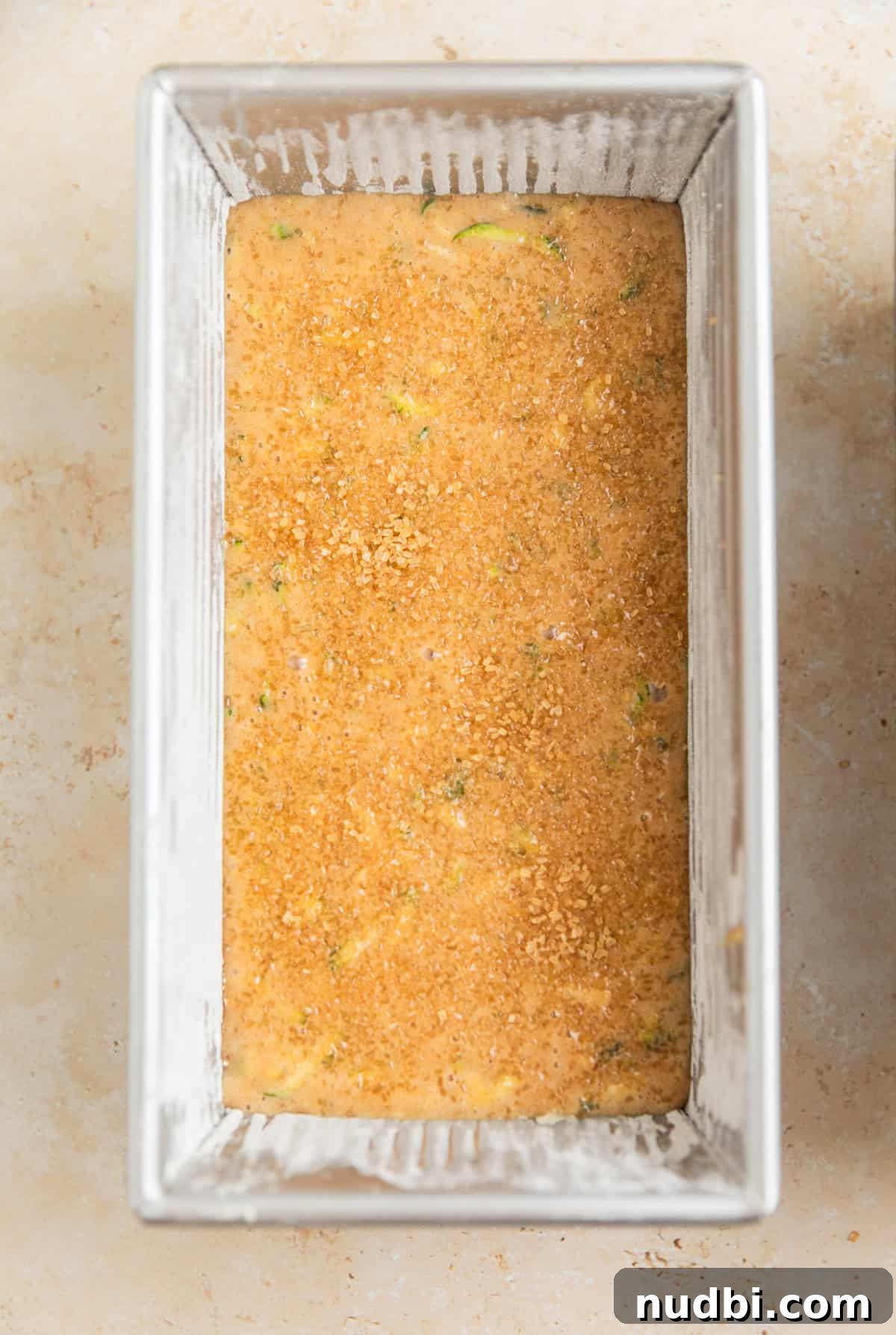 Grandma’s Zucchini Bread Recipe (Even Better) 12 Sugar topped zucchini bread batter in bread pan before baking.