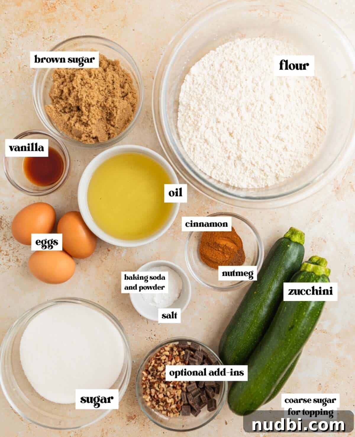 Grandma’s Zucchini Bread Recipe (Even Better) 4 Flour, sugars, oil and other ingredients arranged on surface ready for recipe.
