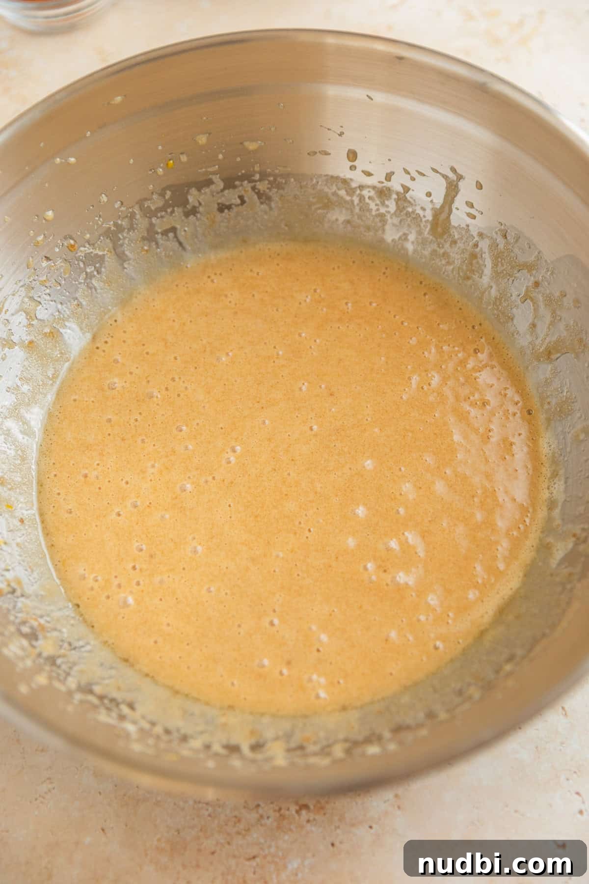 Grandma’s Zucchini Bread Recipe (Even Better) 6 Sugars, oil and vanilla mixed into beaten eggs in bowl.