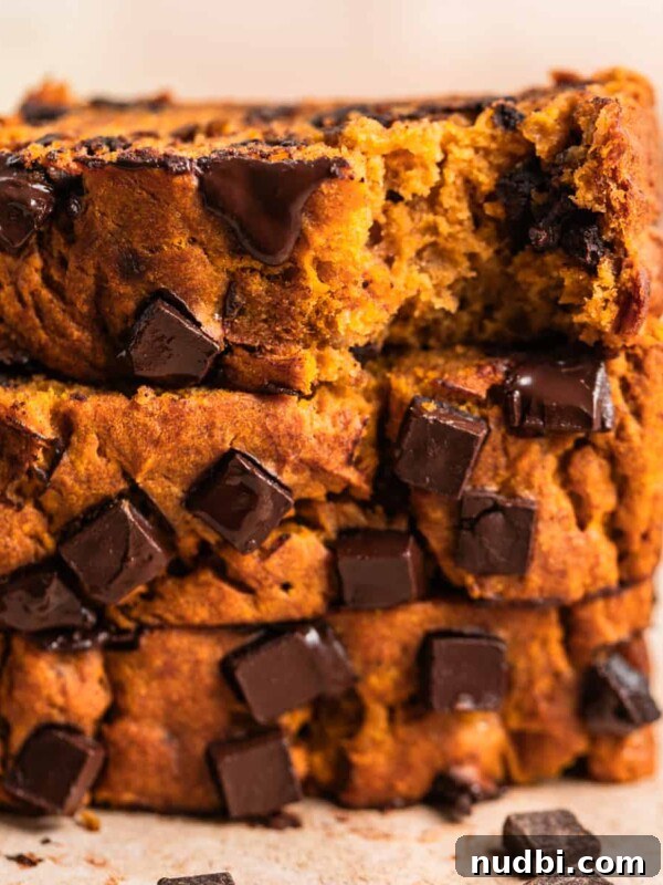 Pumpkin Bread Made from Cake Mix: Quick Moist Recipe 17 Stack of pumpkin banana bread with chocolate chips slices on top of each other.