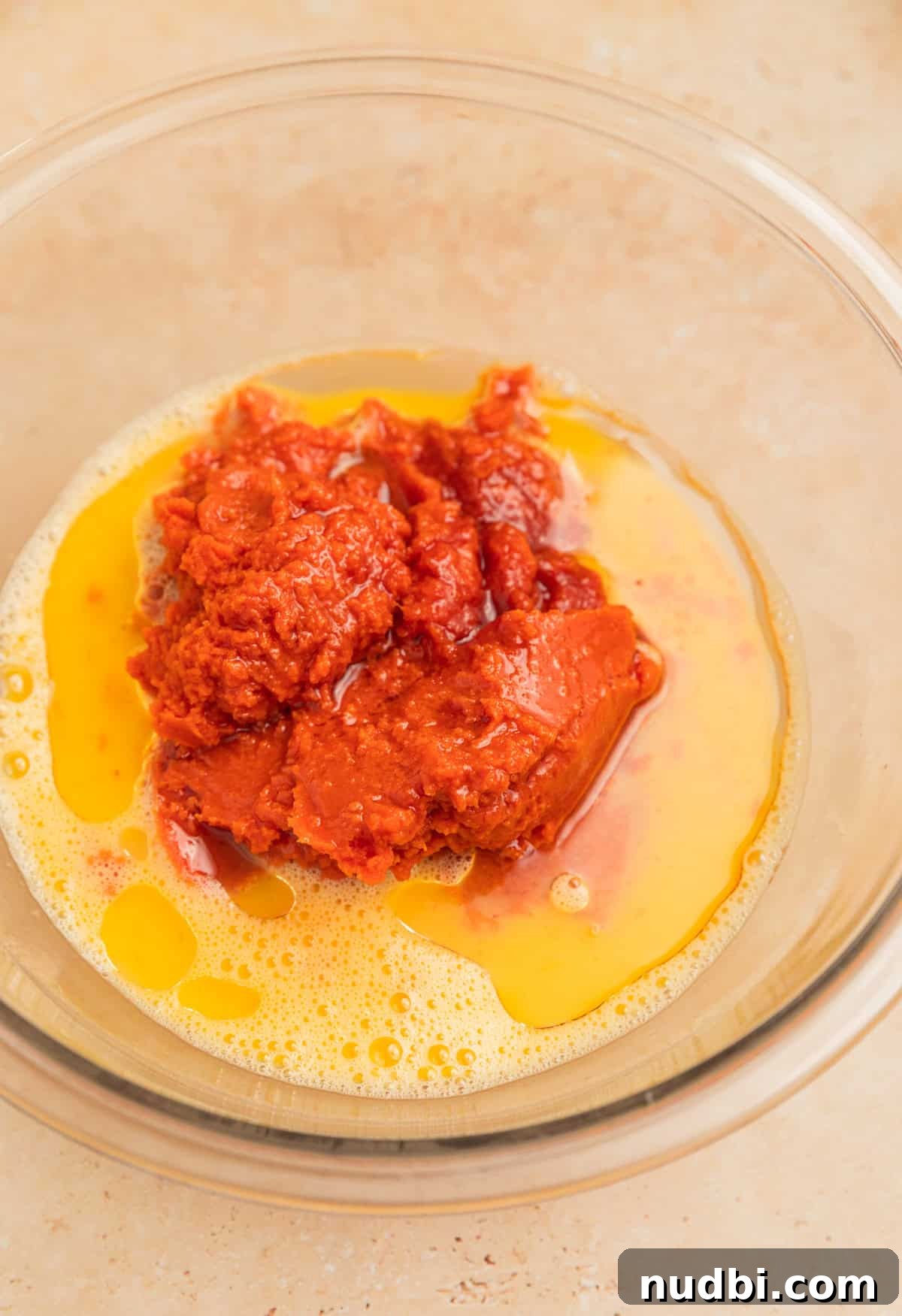 Pumpkin Bread Made from Cake Mix: Quick Moist Recipe 6 Canned pumpkin, oil, milk and other ingredients added to mixing bowl with eggs.