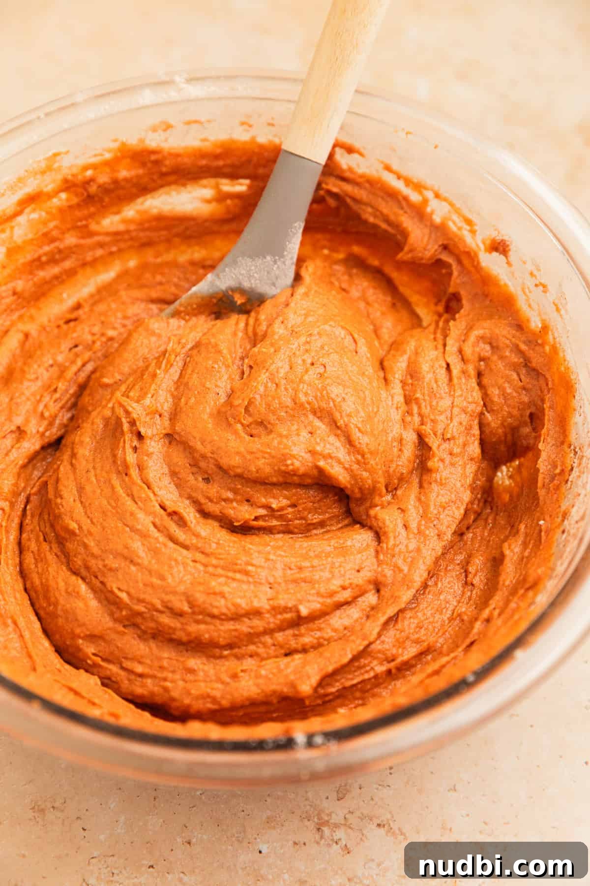 Pumpkin Bread Made from Cake Mix: Quick Moist Recipe 9 Cake mix pumpkin bread mixture in glass mixing bowl with spoon.