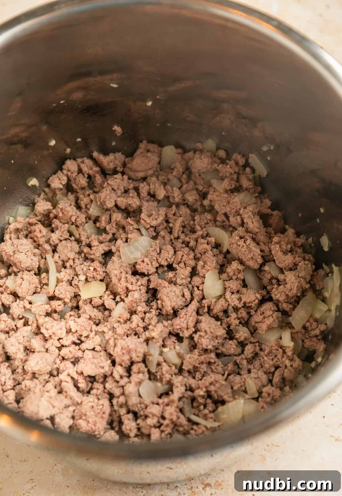 One-Pot Instant Pot Spaghetti Recipe for Quick Weeknight Dinners 6 Ground turkey browning in Instant Pot.