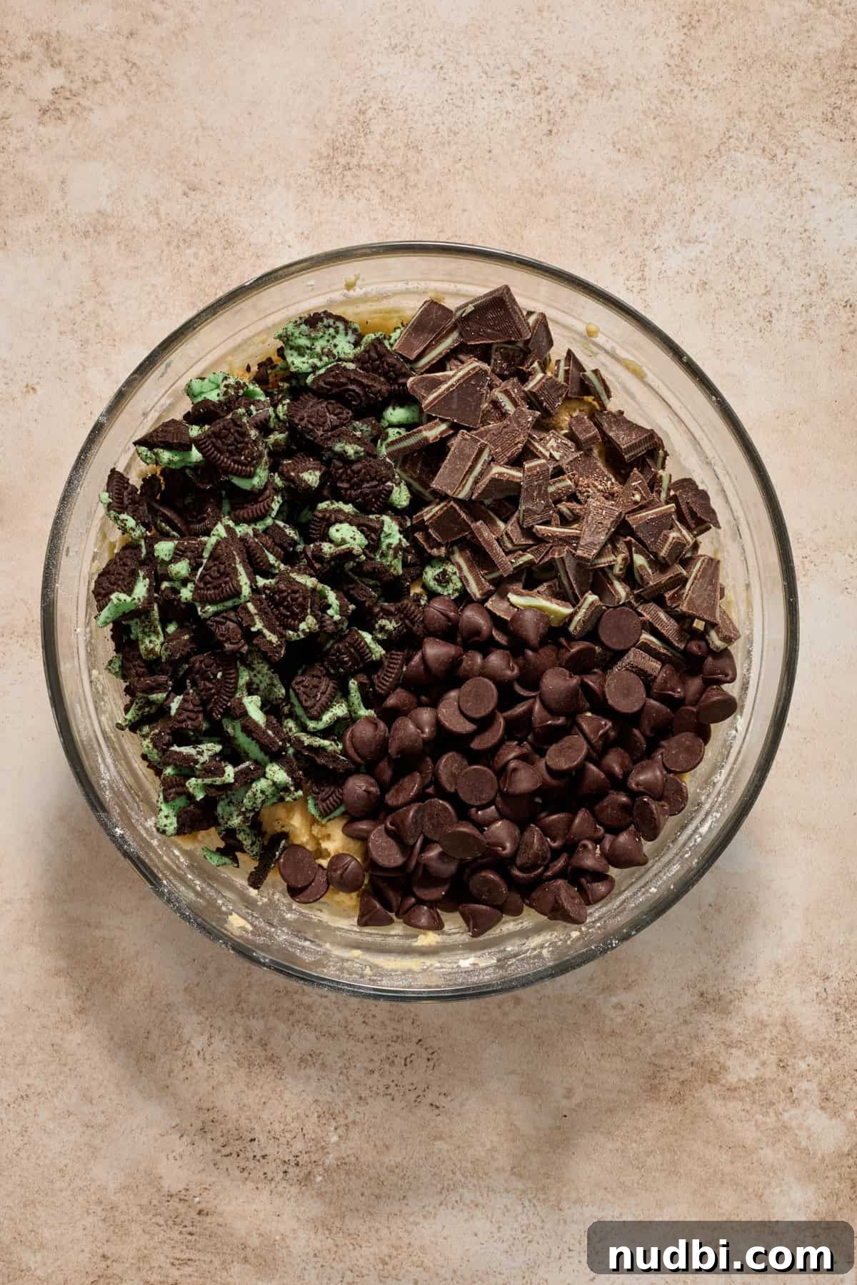 Chewy Mint Chocolate Chip Cookies Recipe for Perfect Cookies 10 Dark chocolate chips, crushed mint Oreo cookies and chopped Andes mints in bowl on top of cookie dough.