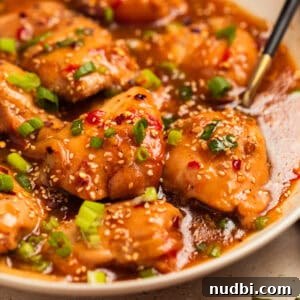 Slow Cooker Apricot-Glazed Chicken Recipe 15 Chicken thighs in apricot sauce with chopped green onions over top.