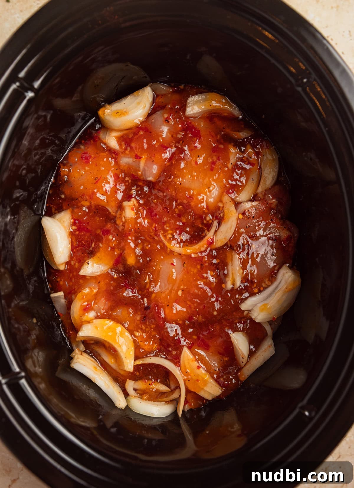 Slow Cooker Apricot-Glazed Chicken Recipe 6 Apricot chicken in crockpot before cooking.
