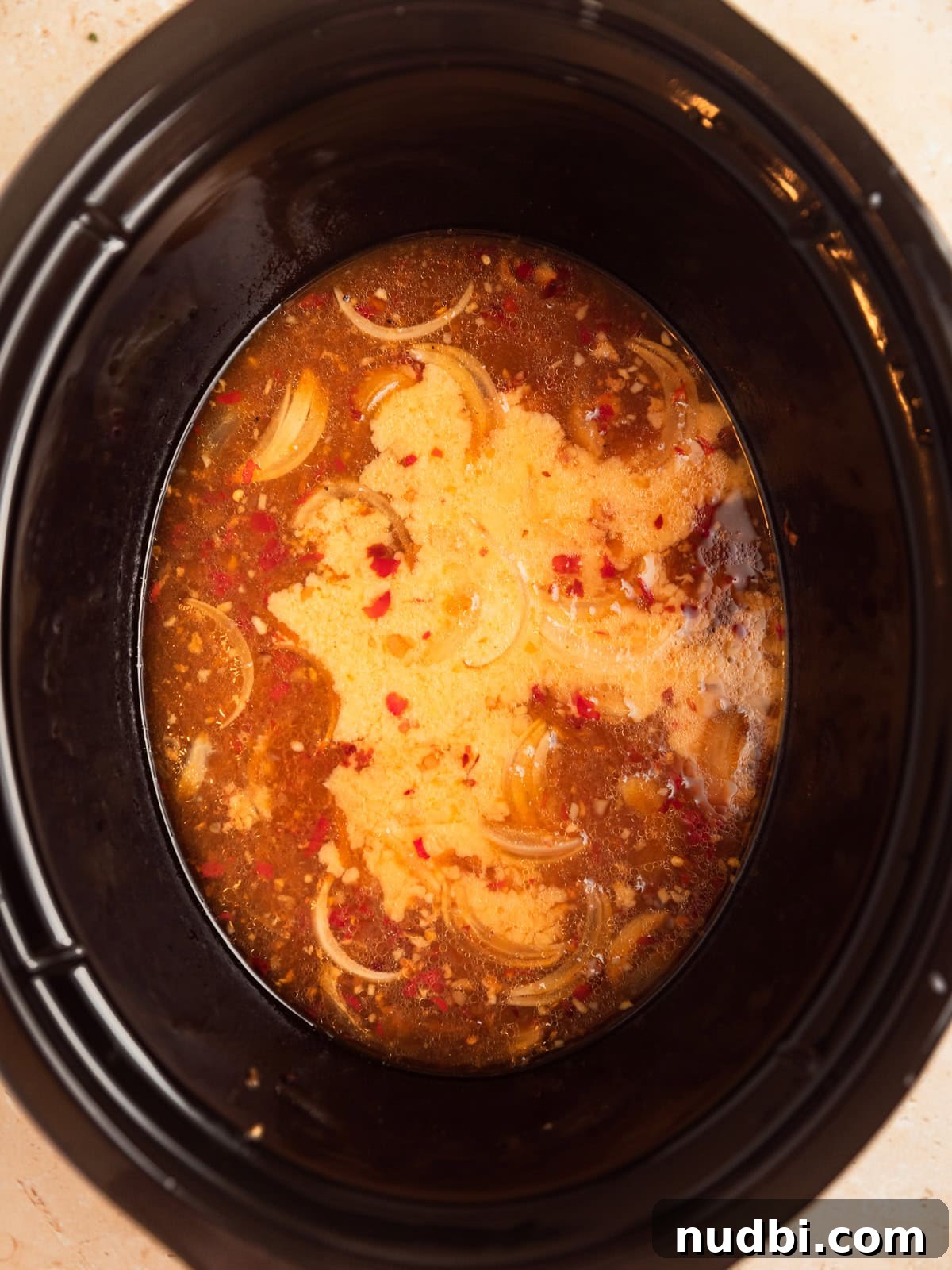 Slow Cooker Apricot-Glazed Chicken Recipe 8 Slurry added to apricot mixture in crockpot.