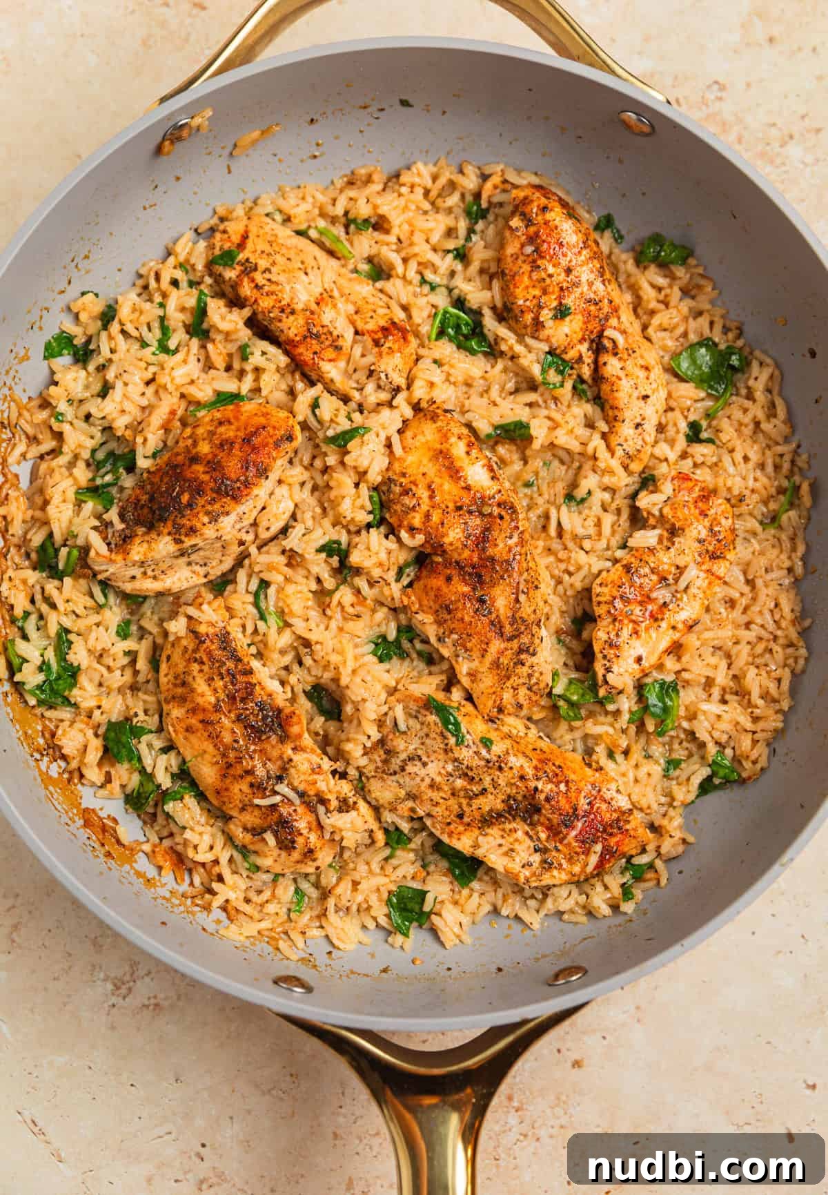 One-Pan Chicken and Rice Skillet Recipe for Flavorful Weeknights 10 One pan chicken and rice with spinach added in.