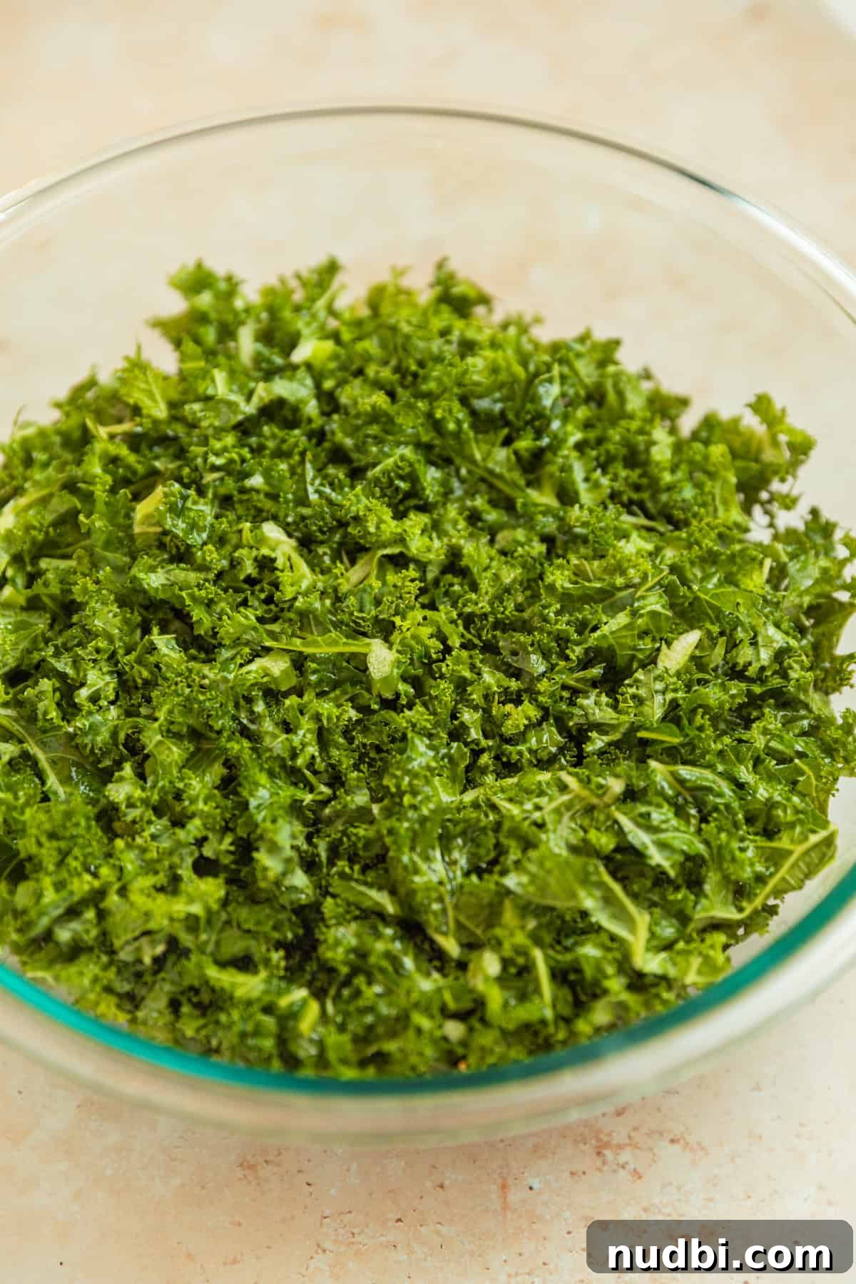Roasted Sweet Potato and Kale Salad with Maple Dijon Dressing 9 Chopped kale massaged in oil and salt.