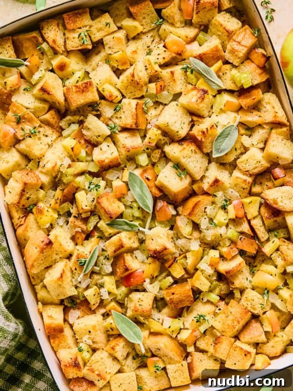 Pan with apple stuffing topped with herbs.