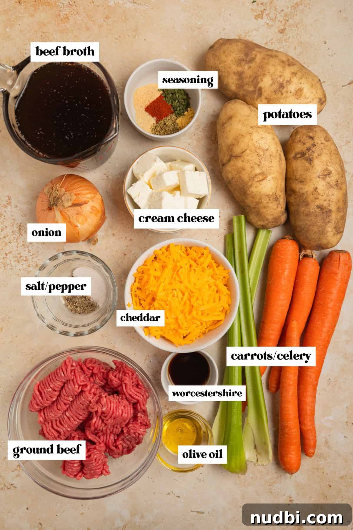 Slow Cooker Cheeseburger Soup Recipe for Weeknight Dinners 4 Potatoes, beef, cheese and other ingredients labeled on surface.