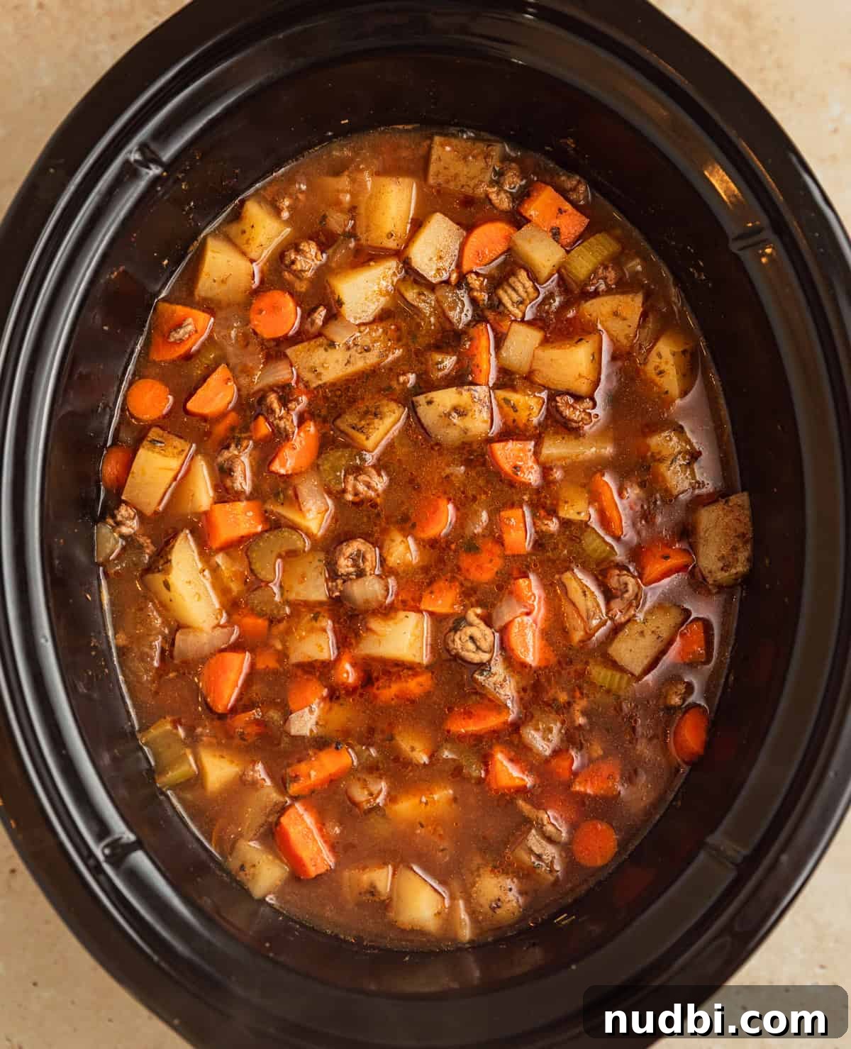 Slow Cooker Cheeseburger Soup Recipe for Weeknight Dinners 8 Crockpot cheeseburger soup in crockpot before adding cheese.