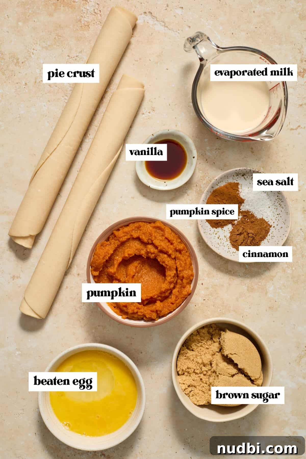 Mini Pumpkin Pies Recipe: Perfect Individual Pumpkin Tarts 4 Rolled up pie crust, pumpkin purée, egg, spices and other ingredients.