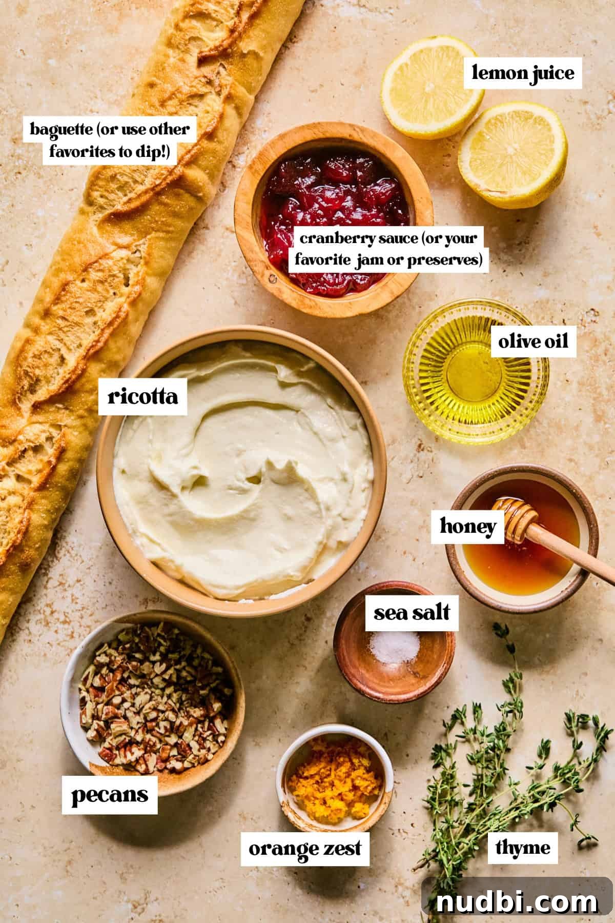 Creamy Whipped Ricotta Dip Recipe for Entertaining 4 Baguette, ricotta, honey, cranberry sauce and other labeled ingredients.