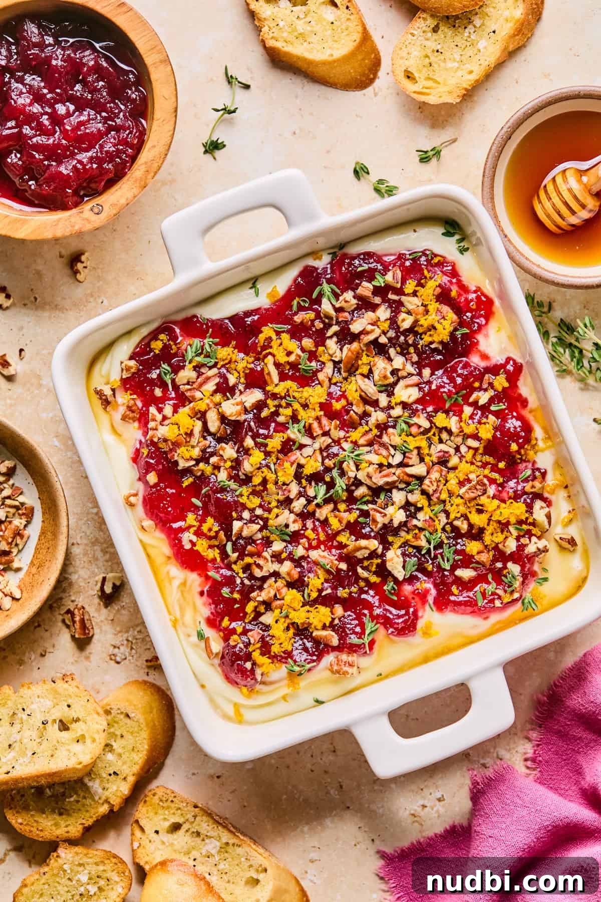 Creamy Whipped Ricotta Dip Recipe for Entertaining 9 Whipped ricotta dip topped with cranberry sauce, honey, pecans, orange zest and thyme.