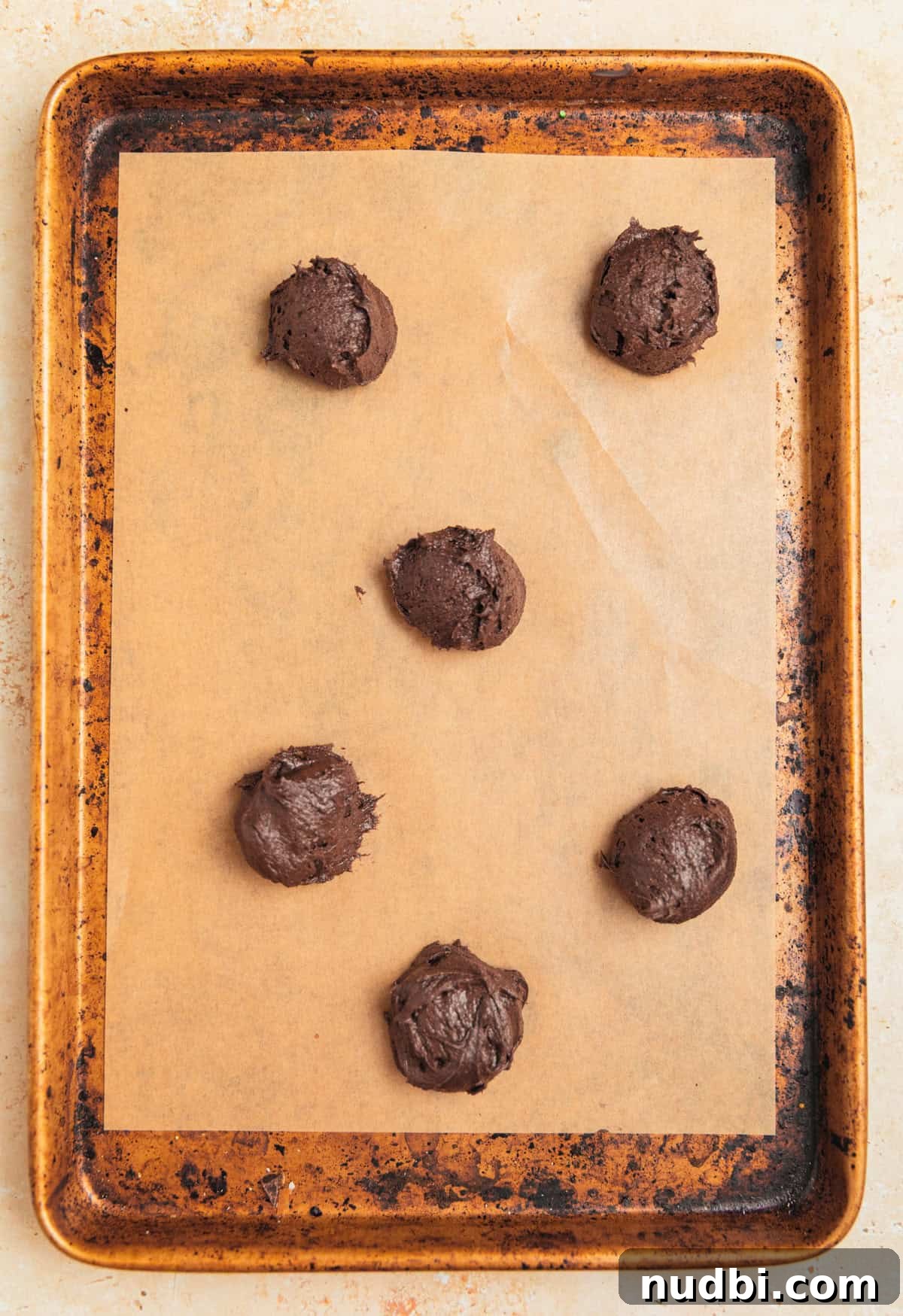 Chewy Brownie Mix Cookies Recipe for Rich Chocolate Treats 7 Chocolate cookie dough scooped onto parchment lined cookie sheet.
