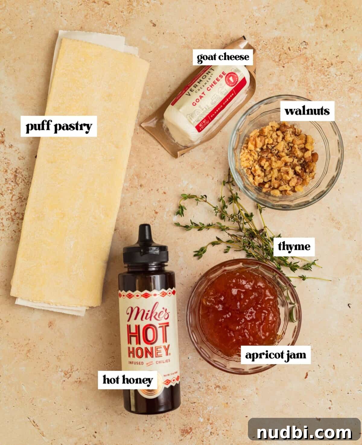 Crispy Goat Cheese Puff Pastry Tart Recipe 4 Puff pastry sheet, apricot jam, goat cheese and other ingredients on surface.