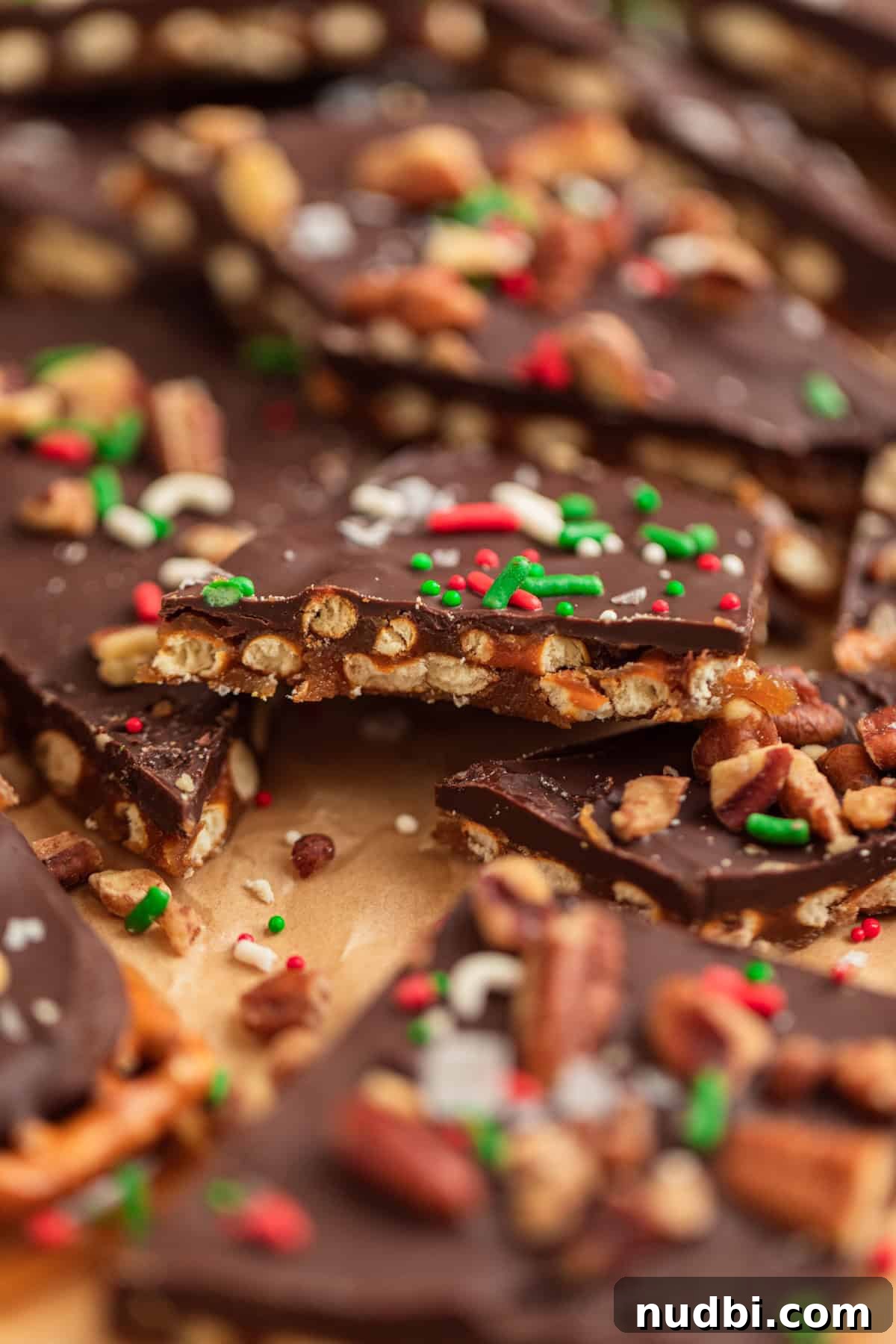 Salted Pretzel Toffee Crunch: Sweet and Salty Candy Recipe 13 Christmas pretzel toffee broken into pieces on parchment.