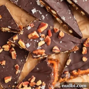 Salted Pretzel Toffee Crunch: Sweet and Salty Candy Recipe 14 Pretzel toffee topped with pecans and sea salt.