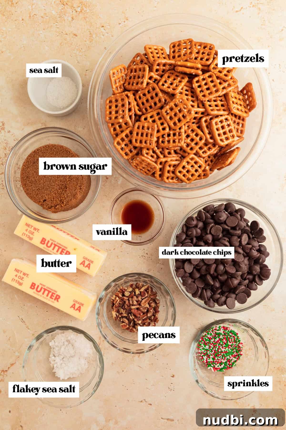 Salted Pretzel Toffee Crunch: Sweet and Salty Candy Recipe 4 Bowl of pretzels, chocolate chips, butter, and other ingredients needed to make recipe.