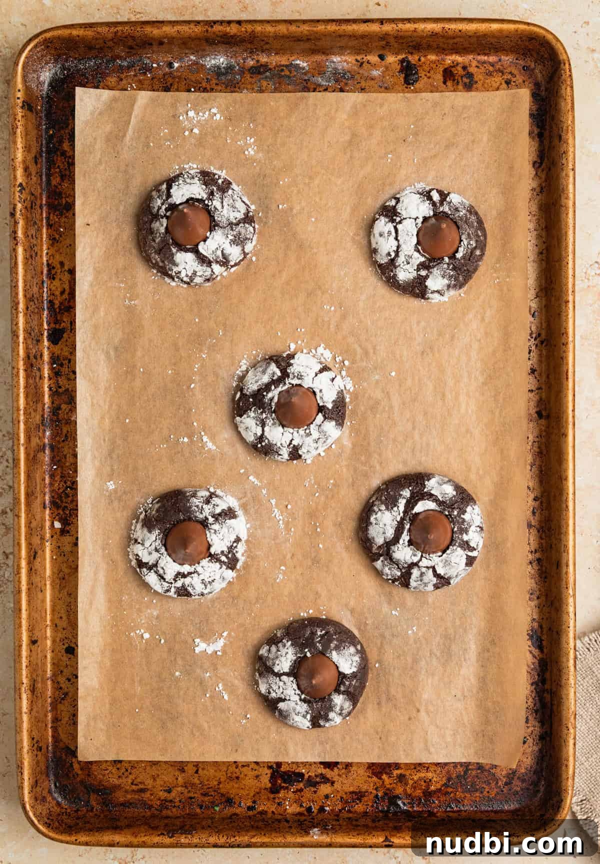 Chocolate Crinkle Blossom Cookies Recipe: Soft Fudgy Chocolate Blossoms 9 Chocolate blossom cookies on sheet pan.