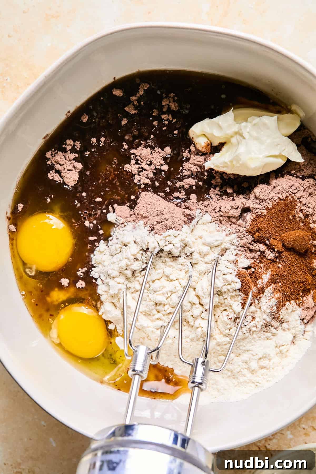 Brownie Crinkle Cookies Recipe — Fudgy, Chewy Chocolate Treats 5 Mixing bowl with brownie mix, eggs, and other ingredients.