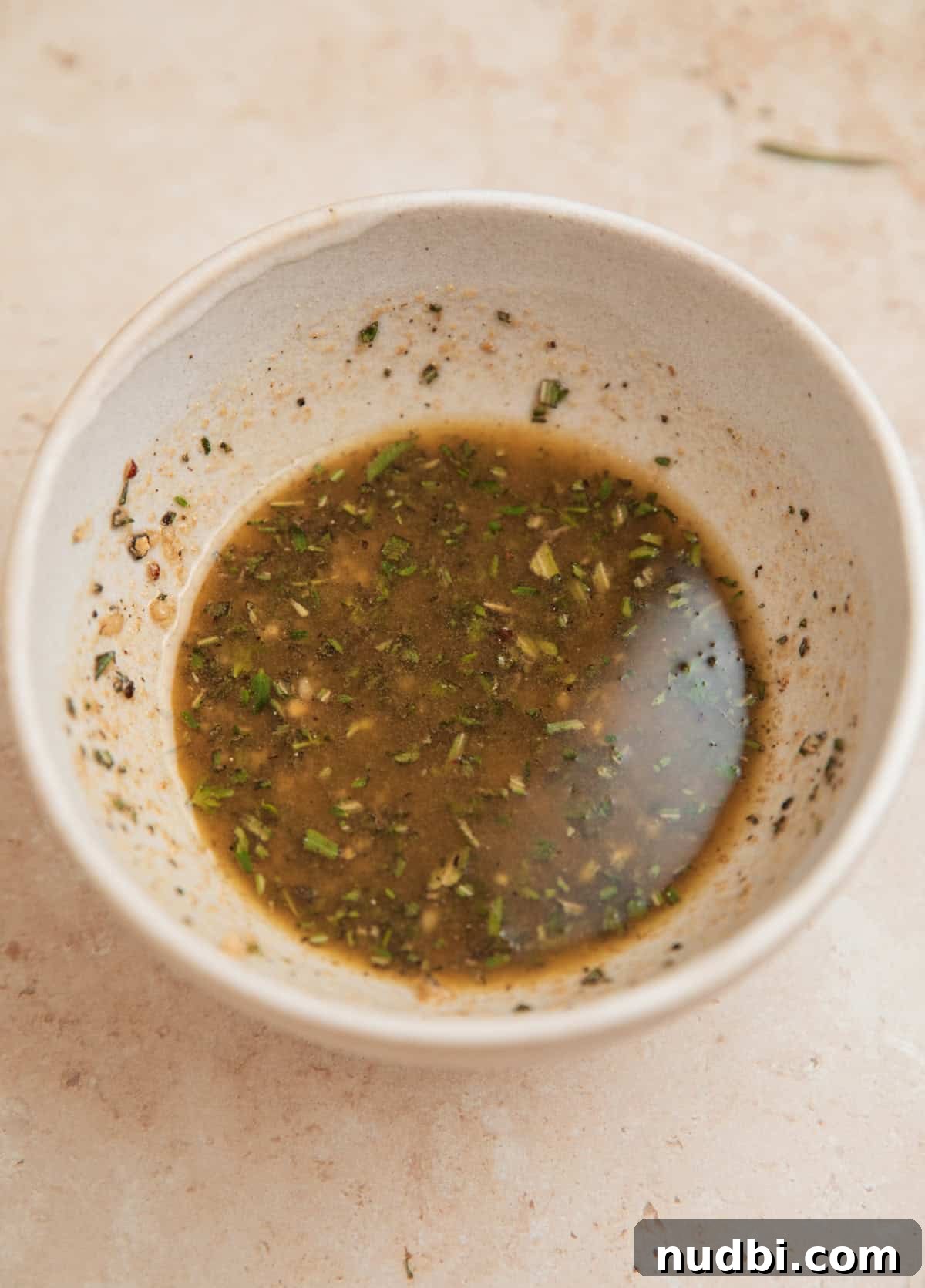 Juicy Top Round Roast Beef Recipe for Tender Slices 6 Herb rub in bowl for roast beef.