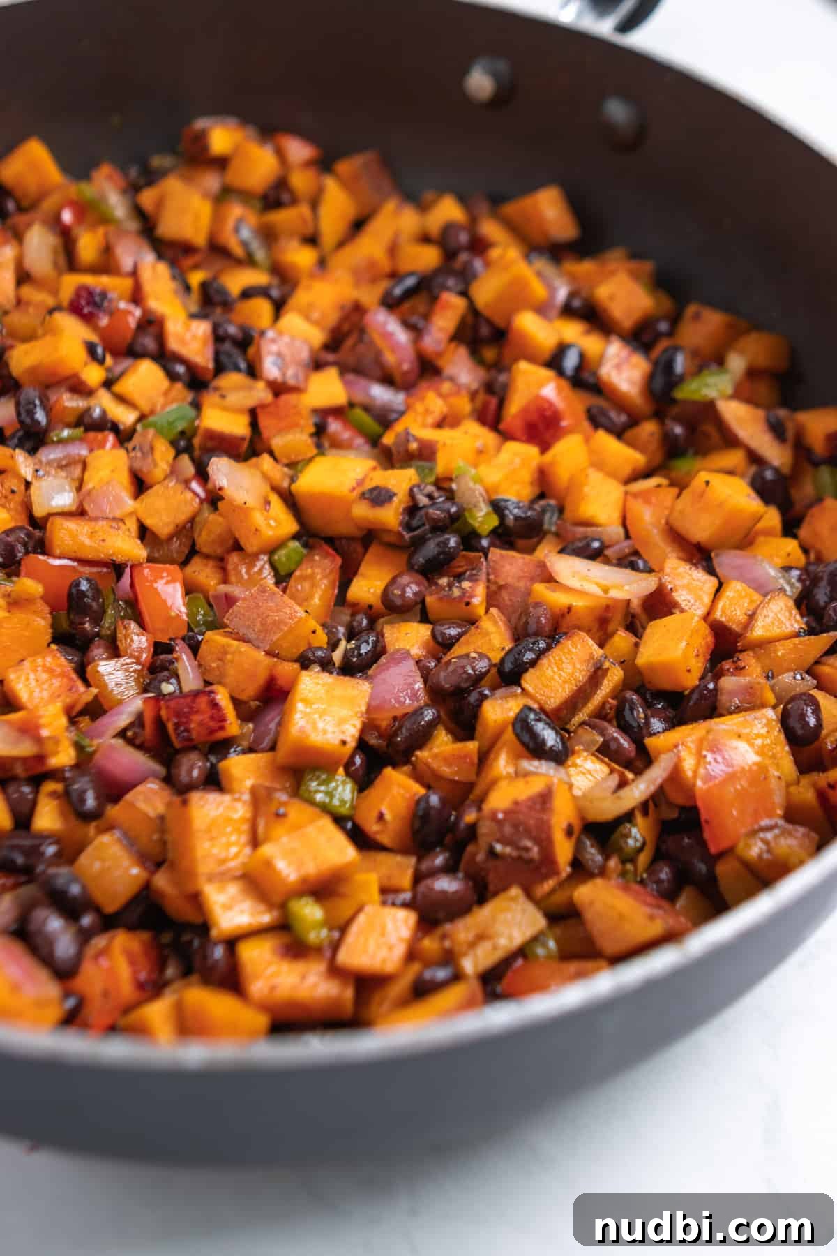 Savory Sweet Potato Breakfast Hash with Crispy Veggies 5 Black beans added into sweet potato skillet breakfast hash.