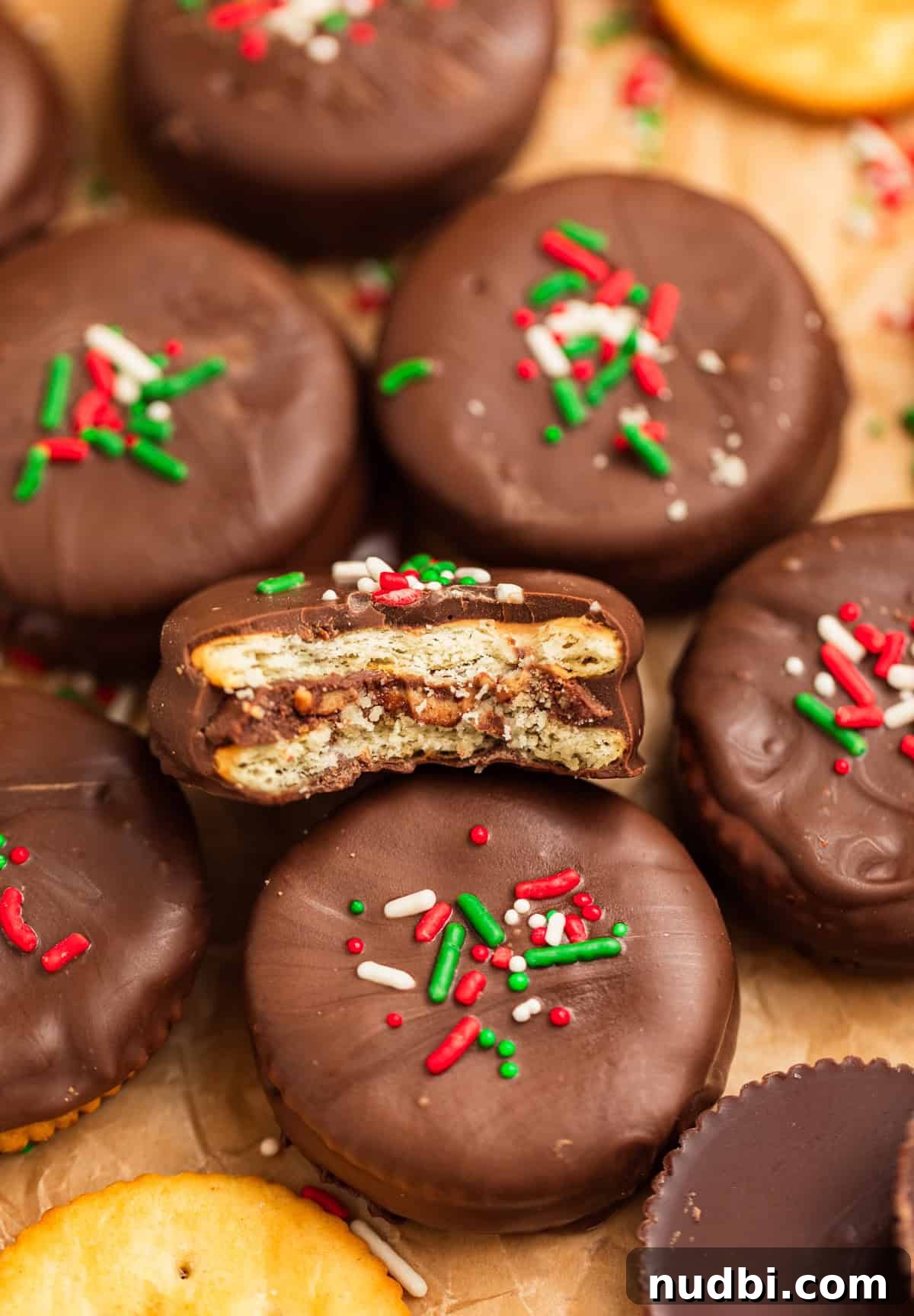 Ritz Cracker Cookies Stuffed with Reese's Cups 2 Chocolate dipped ritz cracker cookies with peanut butter cup inside.