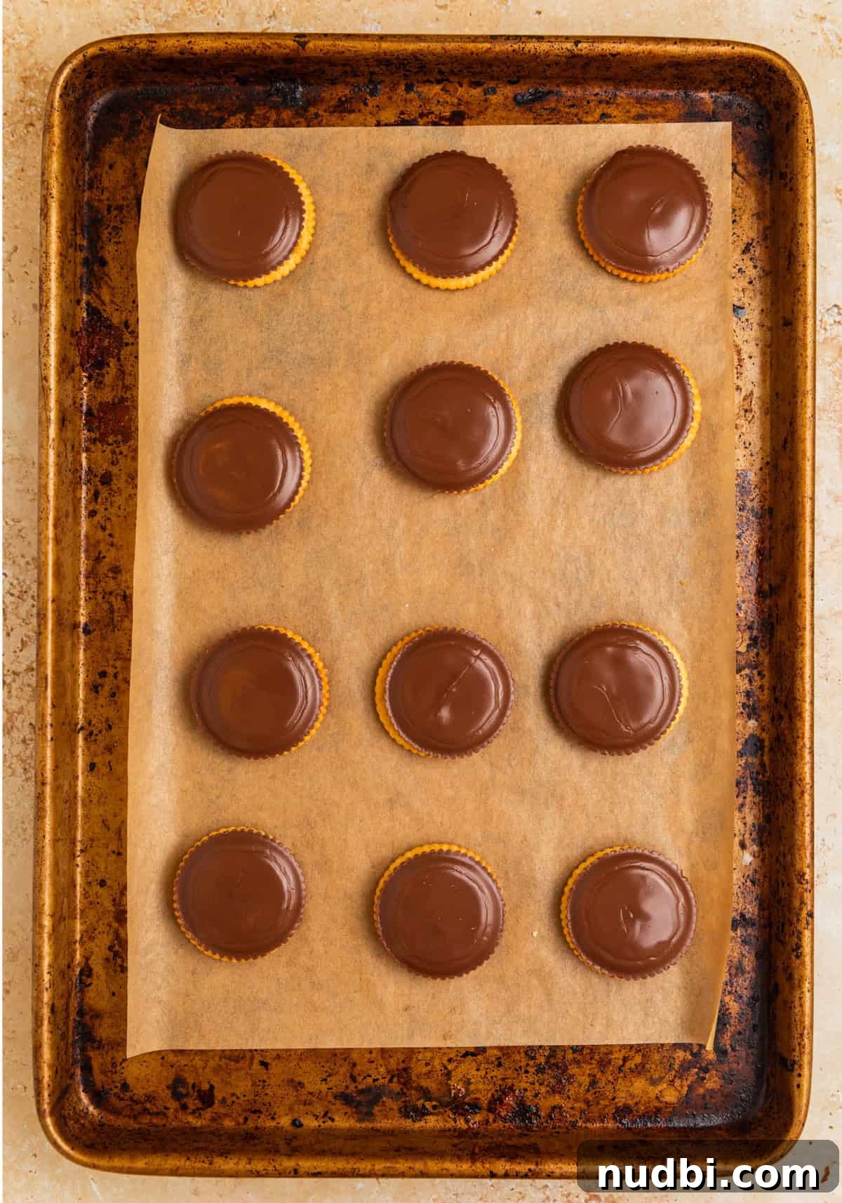 Ritz Cracker Cookies Stuffed with Reese's Cups 6 Melted peanut butter cups on crackers on pan.