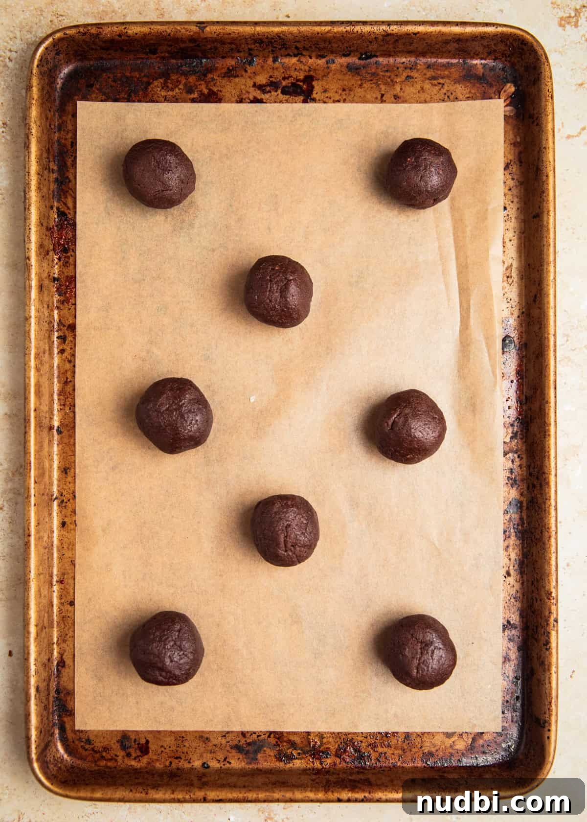 Peppermint Mocha Cookie Recipe — Chocolate Coffee Holiday Cookies 10 Rolled chocolate cookie dough balls on parchment lined cookie sheet.