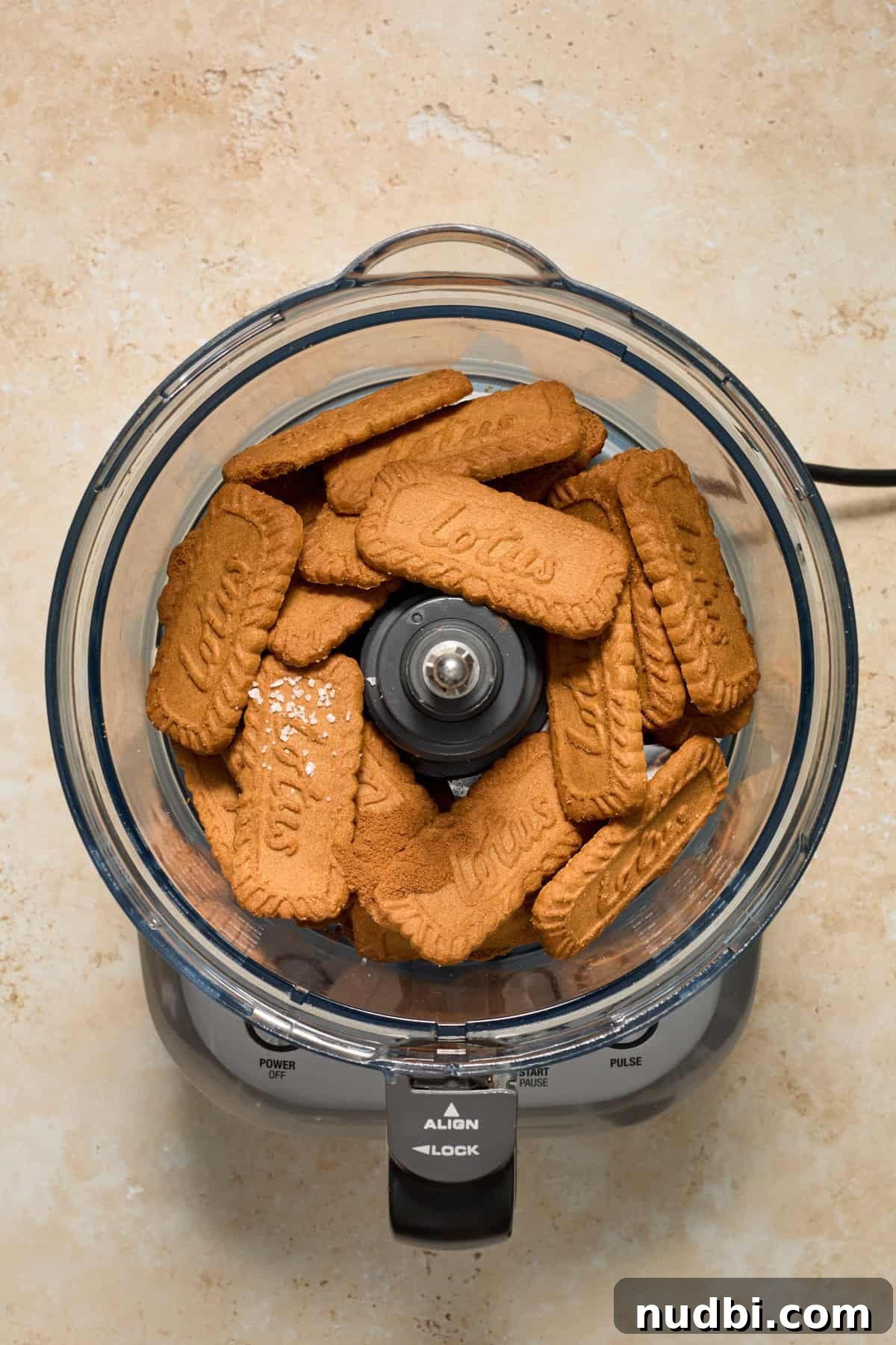 No-Bake Mini Biscoff Cheesecakes Recipe for Crowd-Pleasing Treats 5 Lotus cookies in food processor with sea salt.