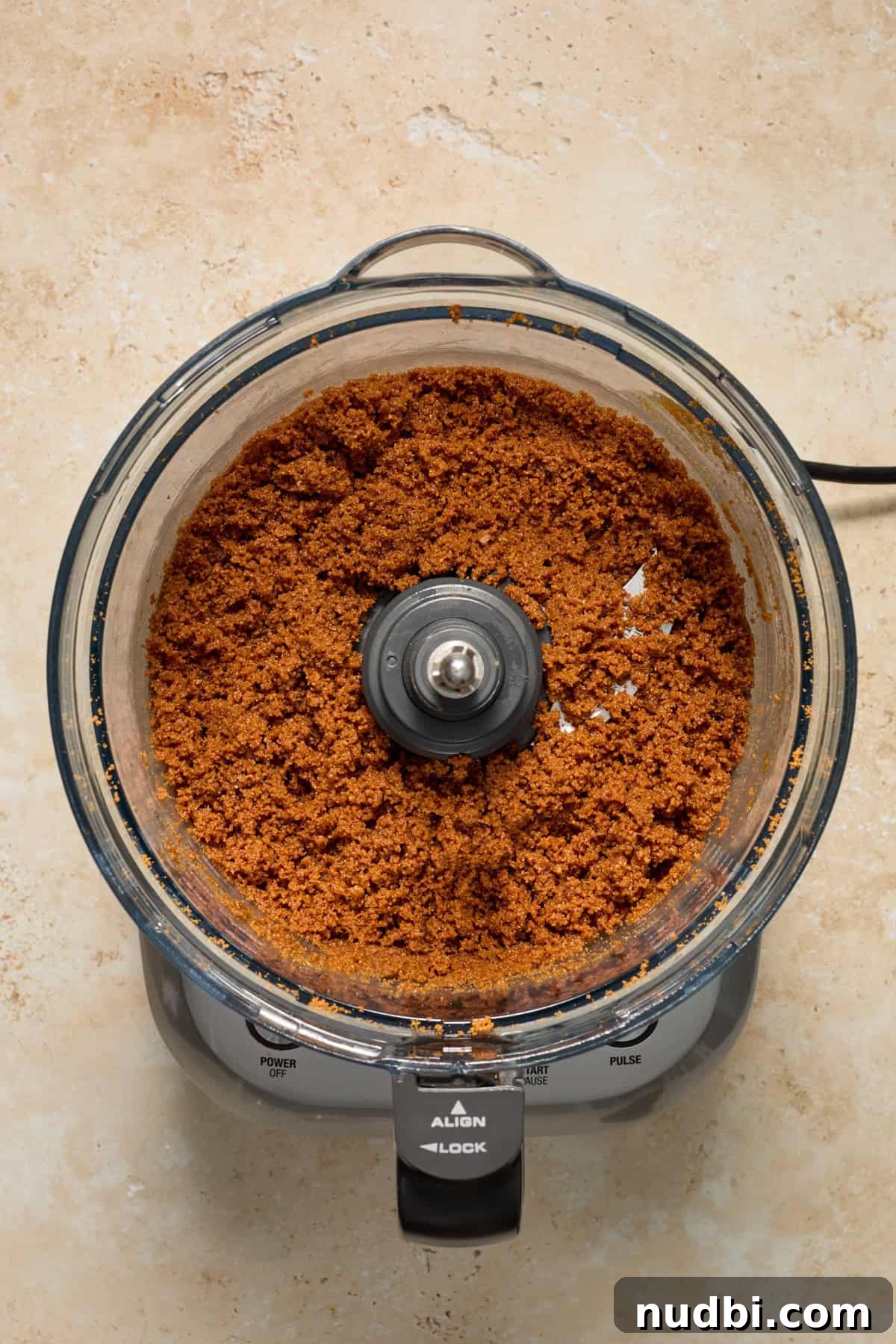 No-Bake Mini Biscoff Cheesecakes Recipe for Crowd-Pleasing Treats 6 Cookie crust mixture in food processor.