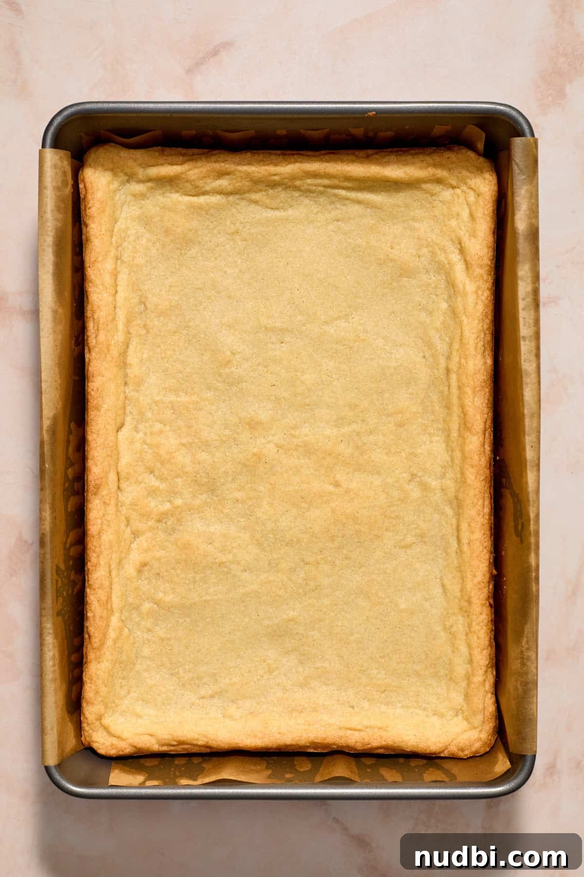 Christmas Sugar Cookie Bars Recipe with Festive Frosting 10 Cooked sugar cookie bar in pan.