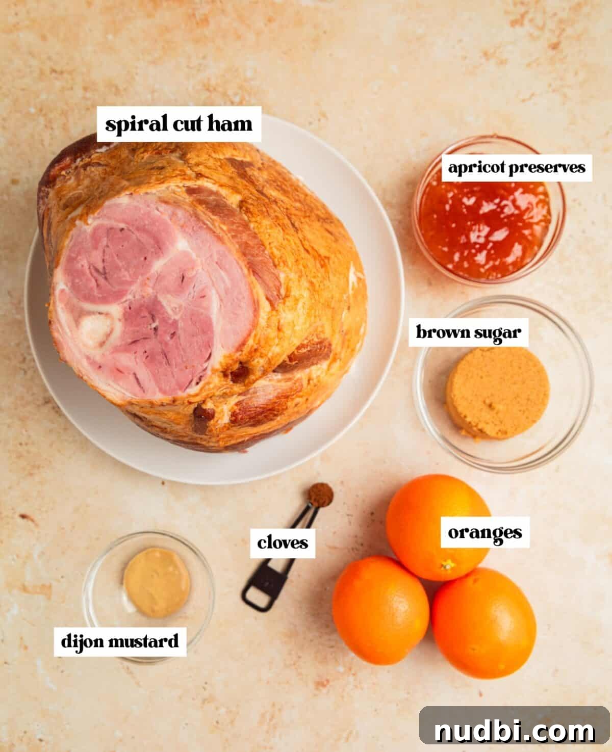 Apricot-Glazed Ham Recipe for Holidays and Entertaining 4 Spiral ham, oranges, dijon mustard and other labeled ingredients.
