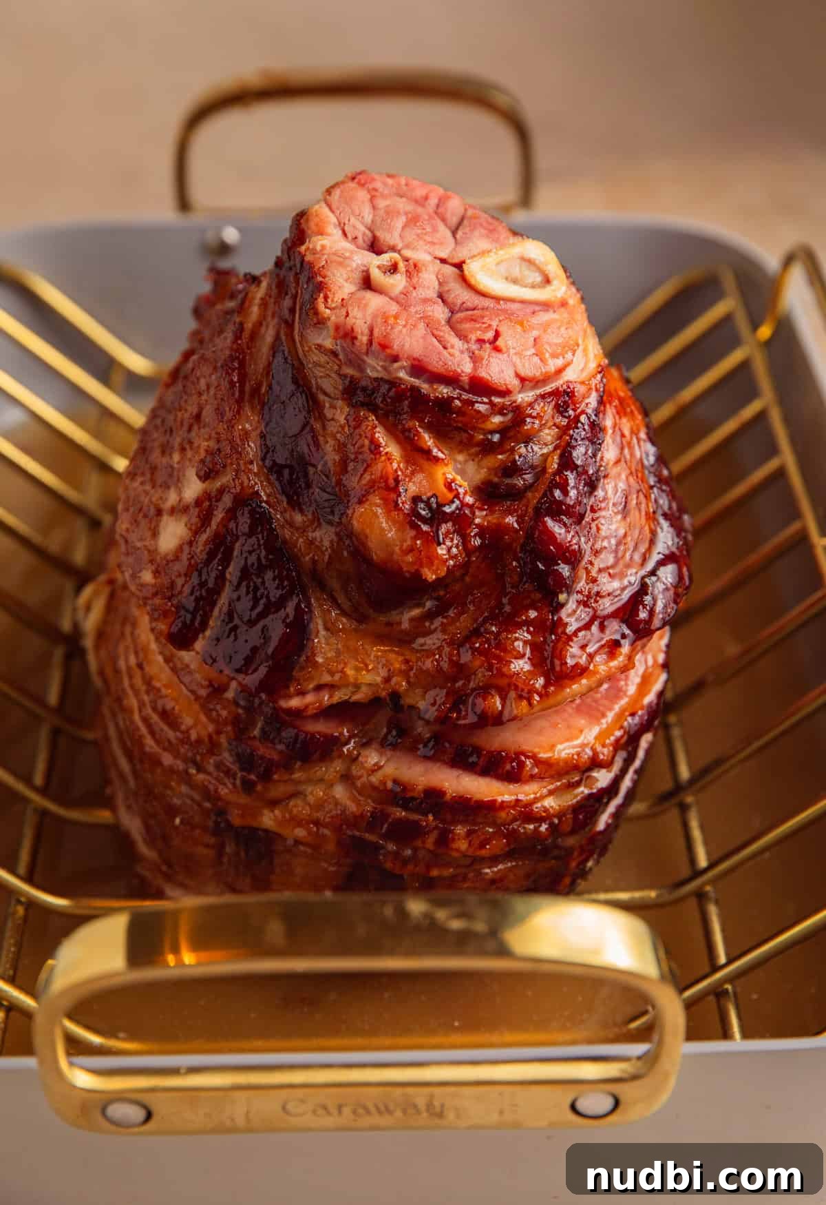 Apricot-Glazed Ham Recipe for Holidays and Entertaining 9 Apricot glaze added to ham.