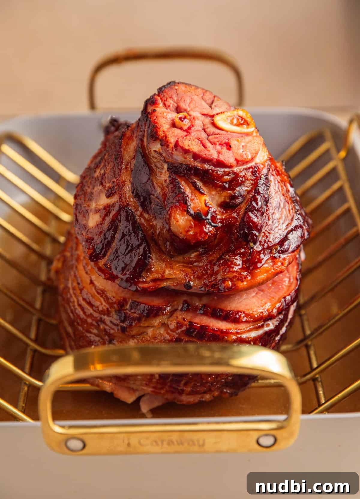 Apricot-Glazed Ham Recipe for Holidays and Entertaining 10 Apricot glazed ham after heating glaze in roasting pan.