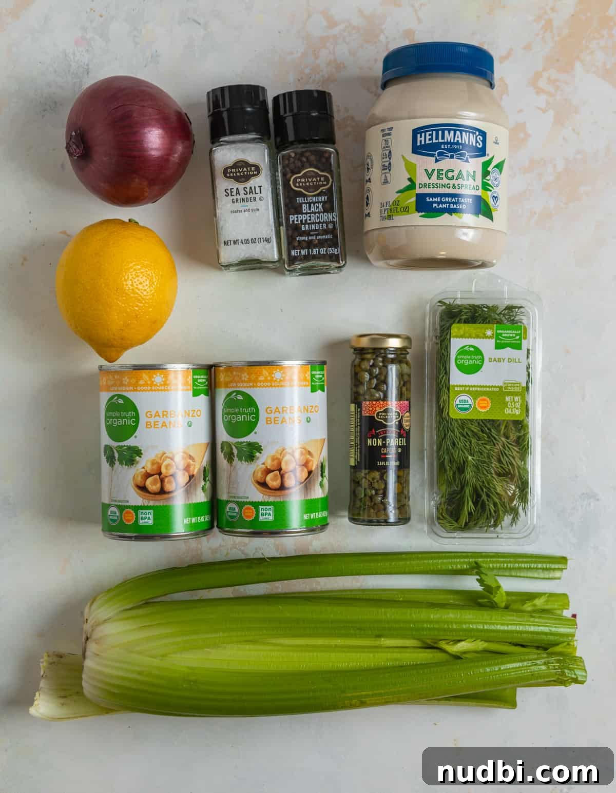 Vegan Chickpea Tuna Salad Recipe — Creamy Plant-Based Lunch 4 Ingredients needed to make vegan chickpea salad laying on counter.