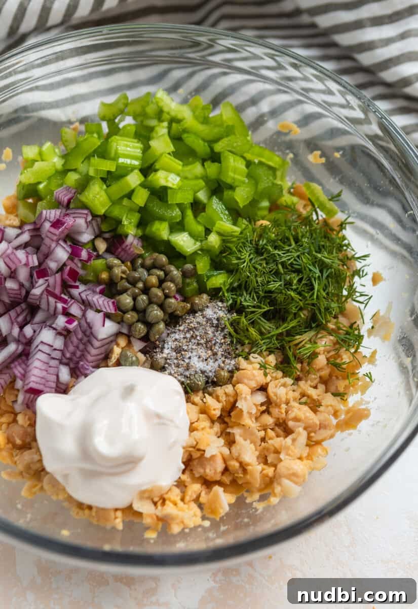 Vegan Chickpea Tuna Salad Recipe — Creamy Plant-Based Lunch 6 Chickpea tuna salad recipe ingredients in mixing bowl before stirring.