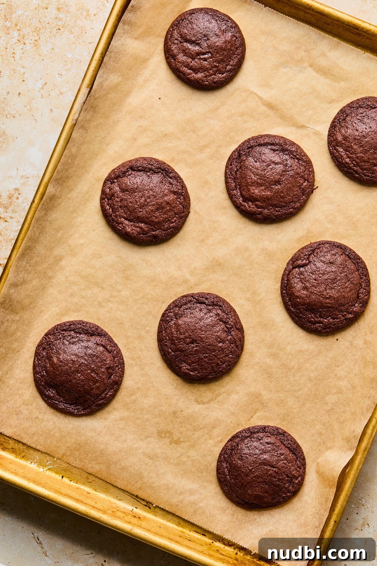 Cosmic Brownie Cookie Recipe: Fudgy, Colorful Chocolate Cookies 11 Baked chocolate cookies on cookie sheet.