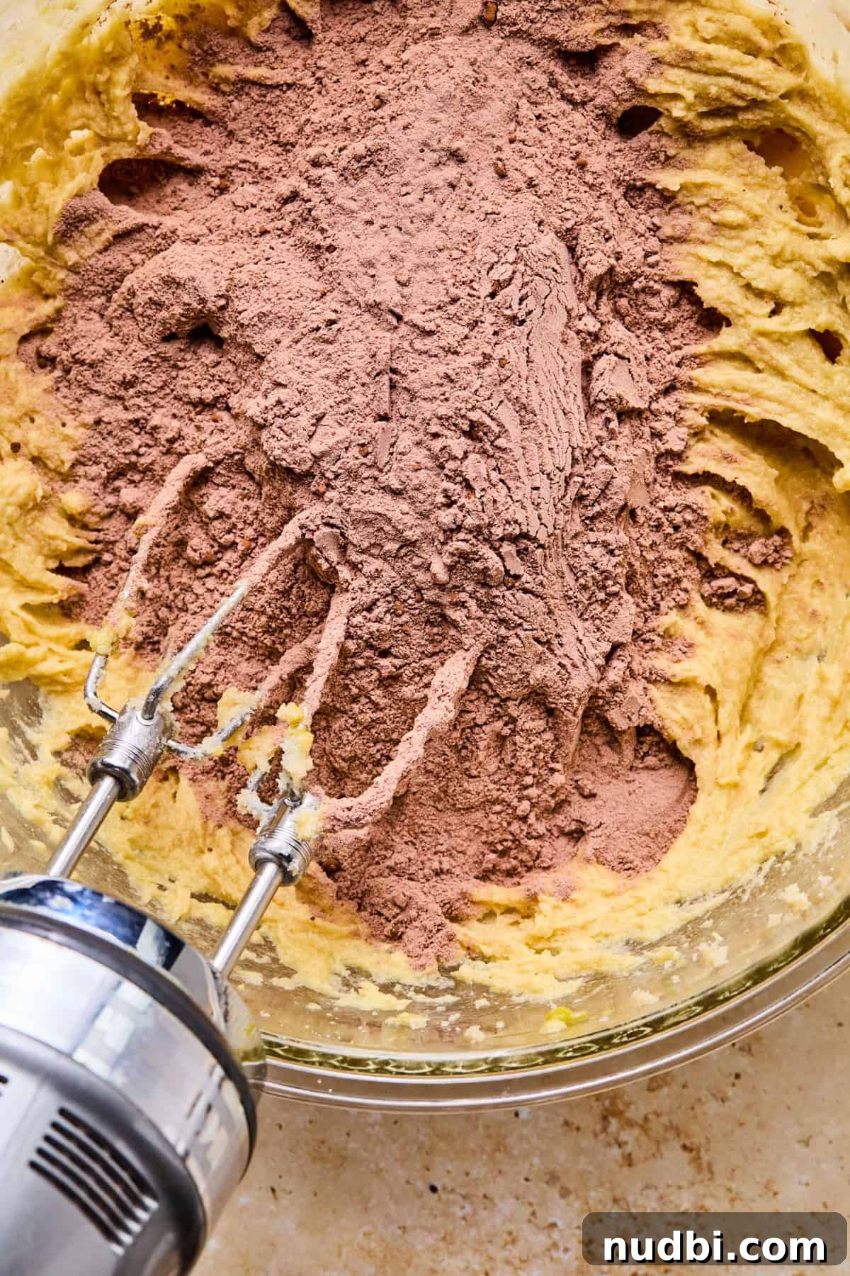 Cosmic Brownie Cookie Recipe: Fudgy, Colorful Chocolate Cookies 8 Cocoa powder added to bowl with wet ingredients.